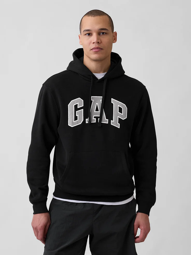 Model wearing the Gap Adult VintageSoft Arch Logo Hoodie in Black